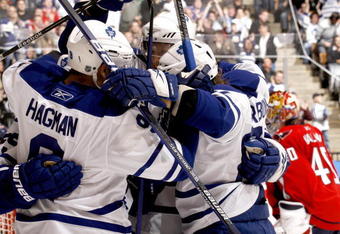 TORONTO - NOVEMBER 21:  Niklas Hagman #9, Jason Blake #55 and Carl Gunnarsson #36 of the Toronto Maple Leafs celebrate goal against the Washington Capitals during game action November 21, 2009 at the Air Canada Centre in Toronto, Ontario, Canada. (Photo by Abelimages/Getty Images)