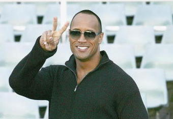 SYDNEY, AUSTRALIA- AUGUST 5:  Actor Dwayne Johnson 'The Rock' arrives to receive the Australian Rugby League official 'Kangaroo' Jersey from a selection of national players at the Aussie Stadium on August 5, 2004 in Sydney, Australia. (Photo by Patrick Riviere/Getty Images)