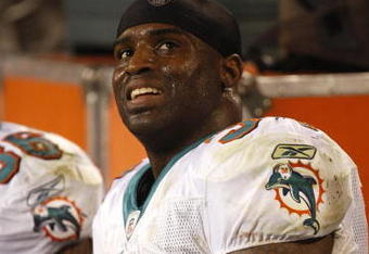 CHARLOTTE - NOVEMBER 19: Ricky Williams #34 of the Miami Dolphins smiles on the bench after he scored his second TD of the game in the second quarter against the Carolina Panthers at Bank of America Stadium on November 19, 2009 in Charlotte, North Carolina.  (Photo by Streeter Lecka/Getty Images)