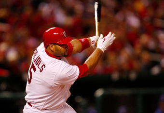 ST. LOUIS, MO - OCTOBER 10:  Albert Pujols #5 of the St. Louis Cardinals hits an RBI single against Los Angeles in the eighth inning of Game Three of the NLDS during the 2009 MLB Playoffs at Busch Stadium on October 10, 2009 in St. Louis, Missouri. (Photo by Dilip Vishwanat/Getty Images)