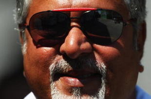 VALENCIA, SPAIN - AUGUST 21:  Force India Chairman Vijay Mallya walks in the paddock during practice for the European Formula One Grand Prix at the Valencia Street Circuit on August 21, 2009, in Valencia, Spain.  (Photo by Ryan Pierse/Getty Images)