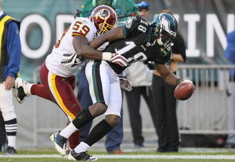 PHILADELPHIA - NOVEMBER 29:  Jeremy Maclin #18 of the Philadelphia Eagles makes a catch and is pushed out of bounds by London Fletcher #59  of the Washington Redskins during their game at Lincoln Financial Field on November 29, 2009 in Philadelphia, Pennsylvania.  (Photo by Al Bello/Getty Images)