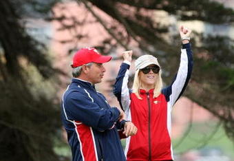 SAN FRANCISCO - OCTOBER 11:  Fred Couples the Captain of the USA Team and Elin Woods celebrate after Tiger Woods had holed the match winning putt at the 13th hole where he beat his opponent Y.E.Yang 6&5 during the Day Four Singles Matches in The Presidents Cup at Harding Park Golf Course on October 11, 2009 in San Francisco, California  (Photo by David Cannon/Getty Images)