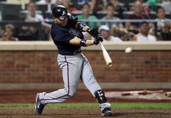 NEW YORK - AUGUST 20:  Omar Infante #4 of the Atlanta Braves bats against the New York Mets on August 20, 2009 at Citi Field in the Flushing neighborhood of the Queens borough of New York City.  (Photo by Jim McIsaac/Getty Images)