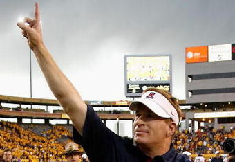 TEMPE, AZ - NOVEMBER 28:  Head coach Mike Stoops of the Arizona Wildcats celebrates after defeating the Arizona State Sun Devils in the college football game at Sun Devil Stadium on November 28, 2009 in Tempe, Arizona.  The Wildcats defeated the Sun Devils 20-17.  (Photo by Christian Petersen/Getty Images)