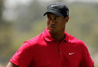 MELBOURNE, AUSTRALIA - NOVEMBER 15:  Tiger Woods of the USA prepares to play an approach shot on the 1st hole during the final round of the 2009 Australian Masters at Kingston Heath Golf Club on November 15, 2009 in Melbourne, Australia.  (Photo by Mark Dadswell/Getty Images)