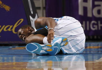 NEW ORLEANS - NOVEMBER 13:  Chris Paul #3 of the New Orleans Hornets lies on the court in pain during the game against the Portland Trail Blazers at New Orleans Arena on November 13, 2009 in New Orleans, Louisiana.  NOTE TO USER: User expressly acknowledges and agrees that, by downloading and or using this photograph, User is consenting to the terms and conditions of the Getty Images License Agreement. (Photo by Chris Graythen/Getty Images)