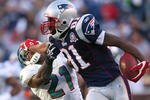FOXBORO, MA - NOVEMBER 8:  Randy Moss #81 of the New England Patriots gains yards against the defense of Vontae Davis of the Miami Dolphins at Gillette Stadium on November 8, 2009 in Foxboro, Massachusetts. The Patriots won 27-17. (Photo by Jim Rogash/Getty Images)