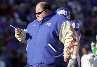 LAWRENCE, KS - NOVEMBER 18:  Mark Mangino  of the Kansas Jayhawks stands on the field during the game against the Kansas State Wildcats on November 18, 2006 at Memorial Stadium in Lawrence, Kansas.  Kansas won 39-20.  (Photo by Brian Bahr/Getty Images)