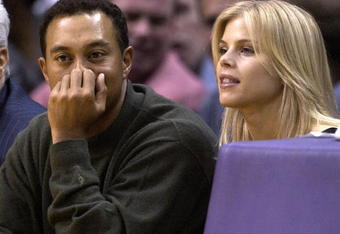LOS ANGELES - FEBRUARY 18:  Golfer Tiger Woods and girlfriend Elin Nordegren attend the game between the Los Angeles Lakers and the Houston Rockets on February 18, 2003 at Staples Center in Los Angeles, Caifornia. (Photo by Vince Bucci/Getty Images)