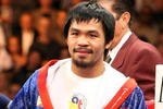 LAS VEGAS - NOVEMBER 14:  Manny Pacquiao smiles before taking on Miguel Cotto during their WBO welterweight title fight at the MGM Grand Garden Arena on November 14, 2009 in Las Vegas, Nevada.  (Photo by Al Bello/Getty Images)