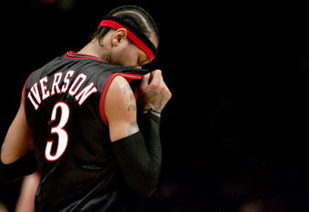 NEW YORK - NOVEMBER 26: Allen Iverson #3 of the Philadelphia 76ers wipes sweat from his face against the New York Knicks on November 26, 2005 at Madison Square Garden in New York City. The Knicks defeated the 76ers in overtime 105-102. NOTE TO USER: User expressly acknowledges and agrees that, by downloading and/or using this Photograph, user is consenting to the terms and conditions of the Getty Images License Agreement.  (Photo by Nick Laham/Getty Images) 
