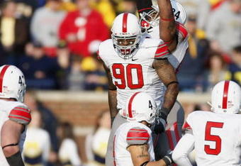 ANN ARBOR, MI - NOVEMBER 21: Thaddeus Gibson #90 of the Ohio State Buckeyes celebrates a fourth quarter interception with teammates while playing the Michigan Wolverines on November 21, 2009 at Michigan Stadium in Ann Arbor, Michigan. Ohio State won the game 21-10. (Photo by Gregory Shamus/Getty Images)
