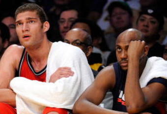 LOS ANGELES, CA - NOVEMBER 29:  Devin Harris (L) Brook Lopez (C) and Trenton Hassell of the New Jersey Nets reacts after a missed shot by a teammate in the closing minutes of the basketball game against the Los Angeles Lakers at Staples Center on November 29, 2009 in Los Angeles, California. The Nets tied for the worst start to an NBA season with their 17th straight loss. NOTE TO USER: User expressly acknowledges and agrees that, by downloading and/or using this Photograph, user is consenting to the terms and conditions of the Getty Images License Agreement.  (Photo by Kevork Djansezian/Getty Images)