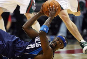MILWAUKEE - NOVEMBER 16: Jason Terry #31 of the Dallas Mavericks looks for a teammate to pass to after slipping on the floor as Luke Ridnour #13 of the Milwaukee Bucks closes in at the Bradley Center on November 16, 2009 in Milwaukee, Wisconsin. The Mavericks defeated the Bucks 115-113 in overtime. (Photo by Jonathan Daniel/Getty Images)