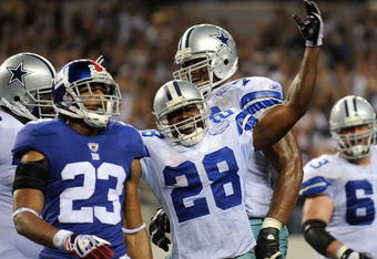 ARLINGTON, TX - SEPTEMBER 20:  Running back Felix Jones #28 of the Dallas Cowboys celebrates his touchown in front of Corey Webster #23 of the New York Giants at Cowboys Stadium on September 20, 2009 in Arlington, Texas.  (Photo by Ronald Martinez/Getty Images)