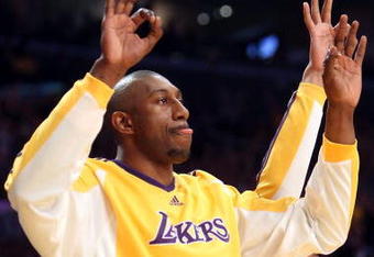 LOS ANGELES, CA - MAY 12:  DJ Mbenga #28 of the Los Angeles Lakers reacts from the bench against the Houston Rockets in Game Five of the Western Conference Semifinals during the 2009 NBA Playoffs at Staples Center on May 12, 2009 in Los Angeles, California. NOTE TO USER: User expressly acknowledges and agrees that, by downloading and or using this photograph, User is consenting to the terms and conditions of the Getty Images License Agreement.  (Photo by Stephen Dunn/Getty Images)