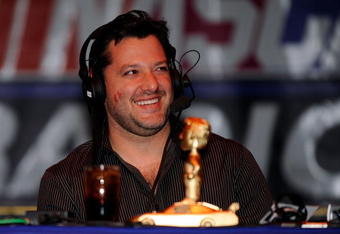 LAS VEGAS - DECEMBER 03:  Driver Tony Stewart smiles during the The Stewies on SIRIUS NASCAR Radio during NASCAR Sprint Cup Series Champions Week on December 3, 2009 in Las Vegas, Nevada.  (Photo by Rusty Jarrett/Getty Images for NASCAR)