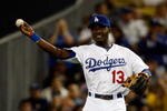 LOS ANGELES, CA - OCTOBER 03: Orlando Hudson #13 of the Los Angeles Dodgers throws the ball to third base after a play while playing against the Colorado Rockies during the game at Dodger Stadium on October 3, 2009 in Los Angeles, California.  (Photo by Jacob de Golish/Getty Images)