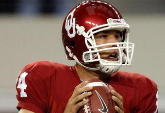 ARLINGTON, TX - SEPTEMBER 05:  Quarterback Sam Bradford #14 of the Oklahoma Sooners drops back to pass against the Brigham Young Cougars at Cowboys Stadium on September 5, 2009 in Arlington, Texas.  (Photo by Ronald Martinez/Getty Images)