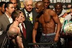 LAS VEGAS - DECEMBER 07:  Floyd Mayweather Jr. (R) stares down at Ricky Hatton of England as Mayweather Jr. is on the scale during the weigh-in at the MGM Grand Garden Arena on December 7, 2007 in Las Vegas, Nevada. Mayweather Jr. will fight Ricky Hatton of England for the WBC welterweight championship on December 8.  (Photo by Al Bello/Getty Images)
