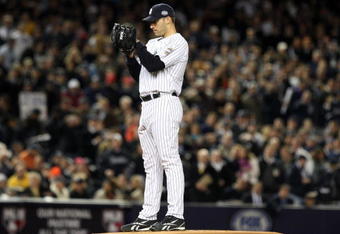 NEW YORK - NOVEMBER 04:  Starting pitcher Andy Pettitte #46 of the New York Yankees gets set to throw a pitch against the Philadelphia Phillies in Game Six of the 2009 MLB World Series at Yankee Stadium on November 4, 2009 in the Bronx borough of New York City. The Yankees won 7-3 to win the Series 4 games to 2.  (Photo by Jed Jacobsohn/Getty Images)