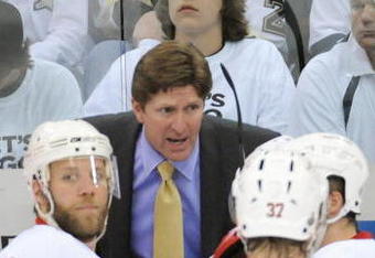 PITTSBURGH - JUNE 9:  Head coach Mike Babcock of the Detroit Red Wings talks to players as Kirk Maltby #18 looks on against the Pittsburgh Penguins during Game Six of the NHL Stanley Cup Finals at the Mellon Arena on June 9, 2009 in Pittsburgh, Pennsylvania. (Photo by: Harry How/Getty Images)
