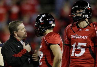 CINCINNATI - NOVEMBER 13:  Head coach Brian Kelly of the the Cincinnati Bearcats speaks to quarterback Zach Collaros #12 with quarterback Tony Pike standing by during warm ups before the game against the West Virginia Mountaineers at Nippert Stadium on November 13, 2009 in Cincinnati, Ohio.  (Photo by Andy Lyons/Getty Images)