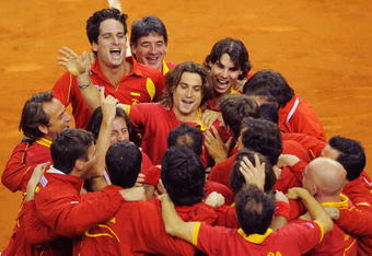 BARCELONA, SPAIN - DECEMBER 05: Feliciano Lopez (L), David Ferrer (C) and Rafael Nadal (R) of Spain celebrate with their team mates after Feliciano Lopez and Fernando Verdasco of Spain beat Radek Stepanek and Tomas Berdych of Czech Republic during the Davis Cup World Group Final doubles match at Palau Sant Jordi stadium on December 5, 2009 in Barcelona, Spain. Spain won the Davis Cup after leading Czech Republic 3-0. (Photo by Denis Doyle/Getty Images)