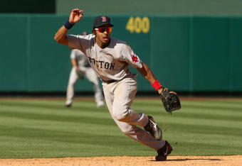 ANAHEIM, CA - MAY 14: Shortstop Julio Lugo #23 of the Boston Red Sox plays in the field against the Los Angeles Angels of Anaheim on May 14, 2009 at Angel Stadium in Anaheim, California.   The Angels won 5-4 in 12 innings.  (Photo by Stephen Dunn/Getty Images)