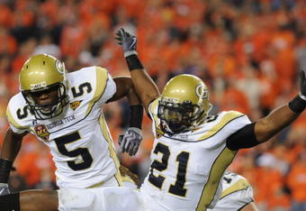 TAMPA, FL - DECEMBER 5: Running back Jonathan Dwyer #21 of the Georgia Tech Yellow Jackets celebrates a four-yard touchdown run with Stephen Hill #5 against the Clemson Tigers in the 2009 ACC Football Championship Game December 5, 2009 at Raymond James Stadium in Tampa, Florida.  (Photo by Al Messerschmidt/Getty Images)