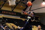 ORLANDO, FL - NOVEMBER 27:  Manny Harris #3 of the Michigan Wolverines attempts a shot against the Marquette Golden Eagles during the Old Spice Classic at Disney's Milk House on November 27, 2009 in Orlando, Florida. Marquette defeated Michigan 79-65.  (Photo by Sam Greenwood/Getty Images)