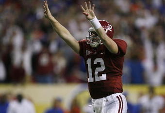 ATLANTA - DECEMBER 5:  Quarterback Greg McElroy #12 of the Alabama Crimson Tide celebrates after Mark Ingram #22 scored a 1-yard touchdown in the fourth quarter against the Florida Gators during the SEC Championship game at Georgia Dome on December 5, 2009 in Atlanta, Georgia.  (Photo by Kevin C. Cox/Getty Images)