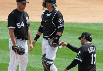 CHICAGO - JUNE 08: Manager Ozzie Guillen #13 of the Chicago White Sox calls for a relief pitcher as he removes starting pitcher Clayton Richard #54 from a game against the Detroit Tigers as A.J. Pierzynski #12 looks to the bullpen on June 8, 2009 at U.S. Cellular Field in Chicago, Illinois. The Tigers defeated the White Sox 5-4. (Photo by Jonathan Daniel/Getty Images)