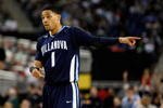 DETROIT - APRIL 04:  Scottie Reynolds #1 of the Villanova Wildcats points while taking on the North Carolina Tar Heels during the National Semifinal game of the NCAA Division I Men's Basketball Championship at Ford Field on April 4, 2009 in Detroit, Michigan.  (Photo by Streeter Lecka/Getty Images)