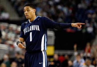 DETROIT - APRIL 04:  Scottie Reynolds #1 of the Villanova Wildcats points while taking on the North Carolina Tar Heels during the National Semifinal game of the NCAA Division I Men's Basketball Championship at Ford Field on April 4, 2009 in Detroit, Michigan.  (Photo by Streeter Lecka/Getty Images)