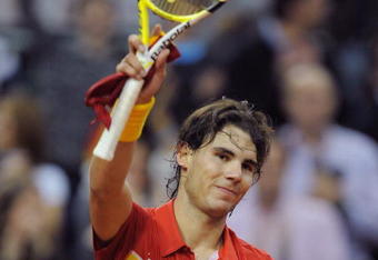 BARCELONA, SPAIN - DECEMBER 06:  Rafael Nadal of Spain salutes the crowd after beating Jan Hajek of Czech Republic in the fourth match of the Davis Cup final  between Spain and Czech Republic at the Palau Sant Jordi stadium on December 6, 2009 in Barcelona, Spain.  (Photo by Denis Doyle/Getty Images)