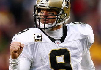 LANDOVER, MD - DECEMBER 06:  Drew Brees #9 of the New Orleans Saints celebrates after team mate Robert Meachem #17 scored a touchdown against the  Washington Redskins on December 6, 2009 at FedExField in Landover, Maryland.  (Photo by Chris McGrath/Getty Images)