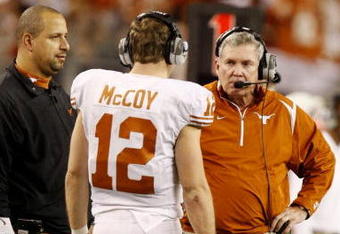 ARLINGTON, TX - DECEMBER 5:  Head coach Mack Brown of the Texas Longhorns speaks to quarterback Colt McCoy #12 during the game against the Nebraska Cornhuskers at Cowboys Stadium on December 5, 2009 in Arlington, Texas. (Photo by Ronald Martinez/Getty Images)
