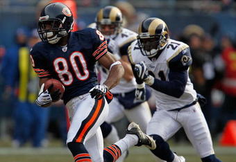 CHICAGO - DECEMBER 06:  Earl Bennett #80 of the Chicago Bears breaks for a long run and is chased by (L-R) Craig Dahl #43 and Oshiomogho Atogwe of the St. Louis Rams at Soldier Field on December 6, 2009 in Chicago, Illinois. The Bears defeated the Rams 17-9.  (Photo by Jonathan Daniel/Getty Images)