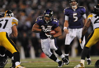 BALTIMORE - NOVEMBER 29:  Ray Rice #27 of the Baltimore Ravens runs the ball towards the center of the hashmarks in overtime to help set up the winning kick  against the Pittsburgh Steelers at M&T Bank Stadium on November 29, 2009 in Baltimore, Maryland. The Ravens defeated the Steelers 20-17. (Photo by Larry French/Getty Images)