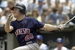 KANSAS CITY, MO - JULY 17:  Lew Ford #20 of the Minnesota Twins watches his hit turn into a two-run homer in the sixth against starting pitcher Jimmy Gobble #41 of the Kansas City Royals July 17, 2004 at Kauffman Stadium in Kansas City, Missouri. (Photo by Dave Kaup/Getty Images)