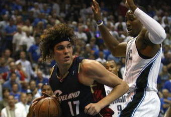 ORLANDO, FL - MAY 30:  Anderson Varejao #17 of the Cleveland Cavaliers handles the ball against Dwight Howard #12 of the Orlando Magic in Game Six of the Eastern Conference Finals during the 2009 Playoffs at Amway Arena on May 30, 2009 in Orlando, Florida. NOTE TO USER: User expressly acknowledges and agrees that, by downloading and or using this photograph, User is consenting to the terms and conditions of the Getty Images License Agreement  (Photo by Elsa/Getty Images)