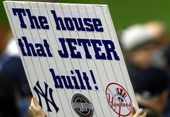 NEW YORK - NOVEMBER 04:  A fan of the New York Yankees holds up a sign which reads 'The House that Jeter built' in reference to Derek Jeter #2 of the Yankees against the Philadelphia Phillies in Game Six of the 2009 MLB World Series at Yankee Stadium on November 4, 2009 in the Bronx borough of New York City.  (Photo by Chris McGrath/Getty Images)
