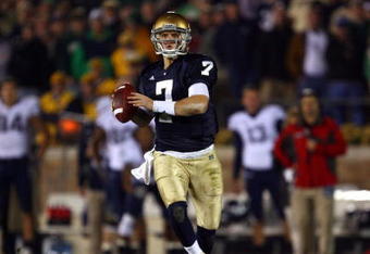 SOUTH BEND, IN - NOVEMBER 21: Jimmy Clausen #7 of the Notre Dame Fighting Irish looks for a receiver against the Univeristy of Connecticut Huskies at Notre Dame Stadium on November 21, 2009 in South Bend, Indiana. Connecticut defeated Notre Dame 33-30 in double overtime. (Photo by Jonathan Daniel/Getty Images)