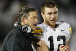 STATE COLLEGE, PA - SEPTEMBER 26:  Head coach Kirk Ferentz of the Iowa Hawkeyes talks with Ricky Stanzi #12 while playing the Penn State Nittnay Lions  on September 26, 2009 at Beaver Stadium in State College, Pennsylvania. Iowa won the game 21-10. (Photo by Gregory Shamus/Getty Images)