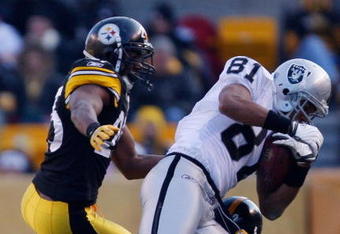 PITTSBURGH - DECEMBER 6: Chaz Schilens #81 of the Oakland Raiders catches a pass in front of Ryan Clark #25 and William Gay #22 of the Pittsburgh Steelers during the game on December 6, 2009 at Heinz Field in Pittsburgh, Pennsylvania. (Photo by Jared Wickerham/Getty Images)