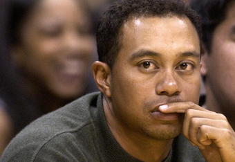 LOS ANGELES - FEBRUARY 18:  Golfer Tiger Woods attends the game between the Los Angeles Lakers and the Houston Rockets on February 18, 2003 at Staples Center in Los Angeles, Caifornia. (Photo by Vince Bucci/Getty Images)