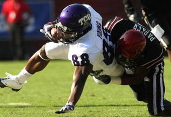 SAN DIEGO - NOVEMBER 7:  Wide receiver Jimmy Young #88 of the Texas Christian University Horned Frogs is tackled after a catch by corner back Larry Parker #7 of the San Diego State Aztecs on November 7, 2009 at Qualcomm Stadium in San Diego, California.    (Photo by Stephen Dunn/Getty Images)