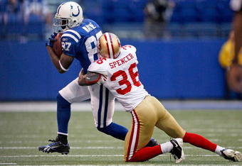 INDIANAPOLIS - NOVEMBER 01:  Reggie Wayne #87 of the Indianapolis Colts is tackled by Shawntae Spencer #36 of the San Francisco 49ers during the NFL game at Lucas Oil Stadium on November 1, 2009 in Indianapolis, Indiana. The Colts won 18-14.  (Photo by Andy Lyons/Getty Images)